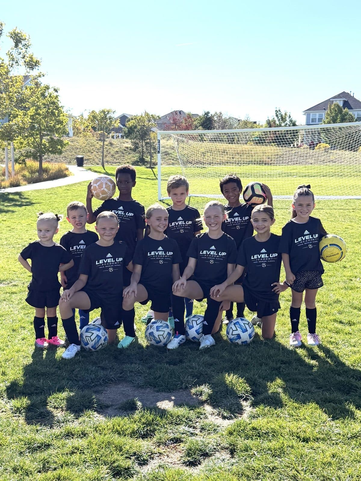 Level Up players standing together in their black academy shirts